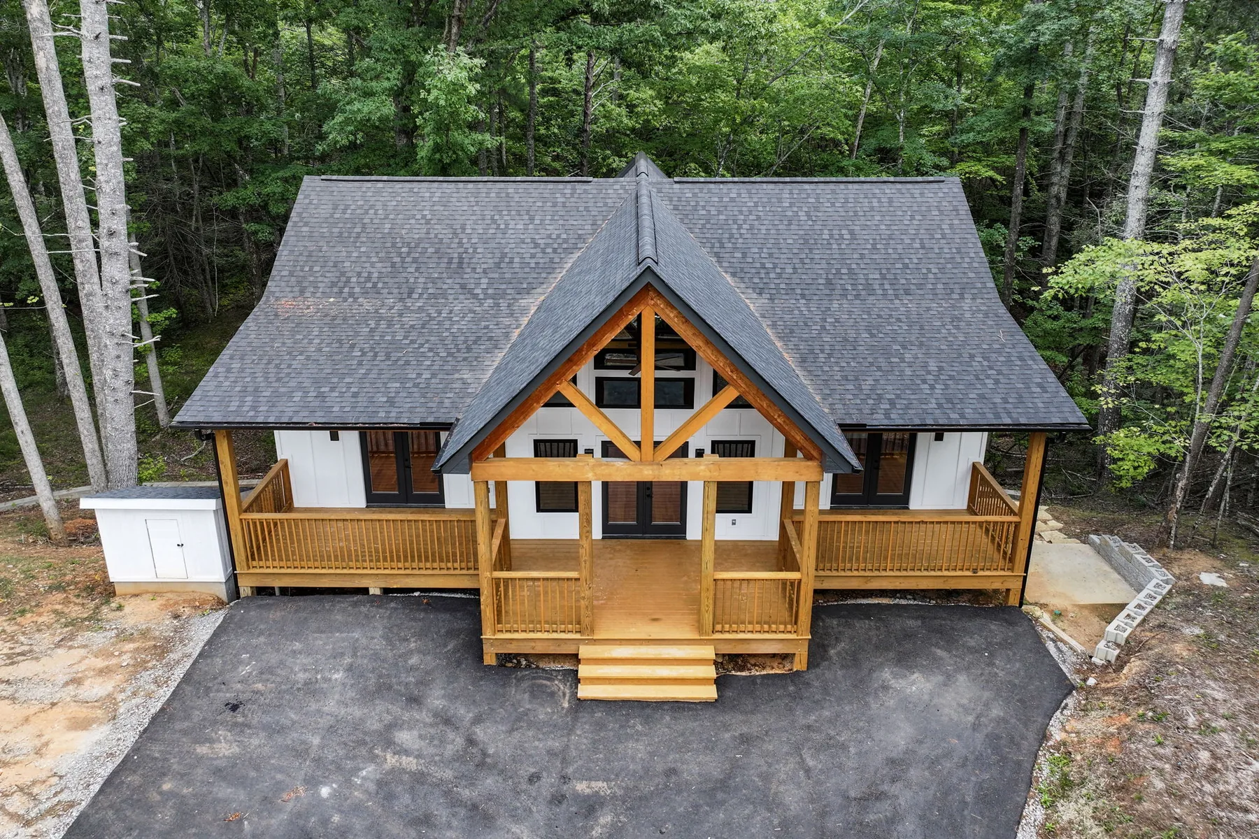 Aerial front elevation of a timber-frame custom home in Lake Lure NC