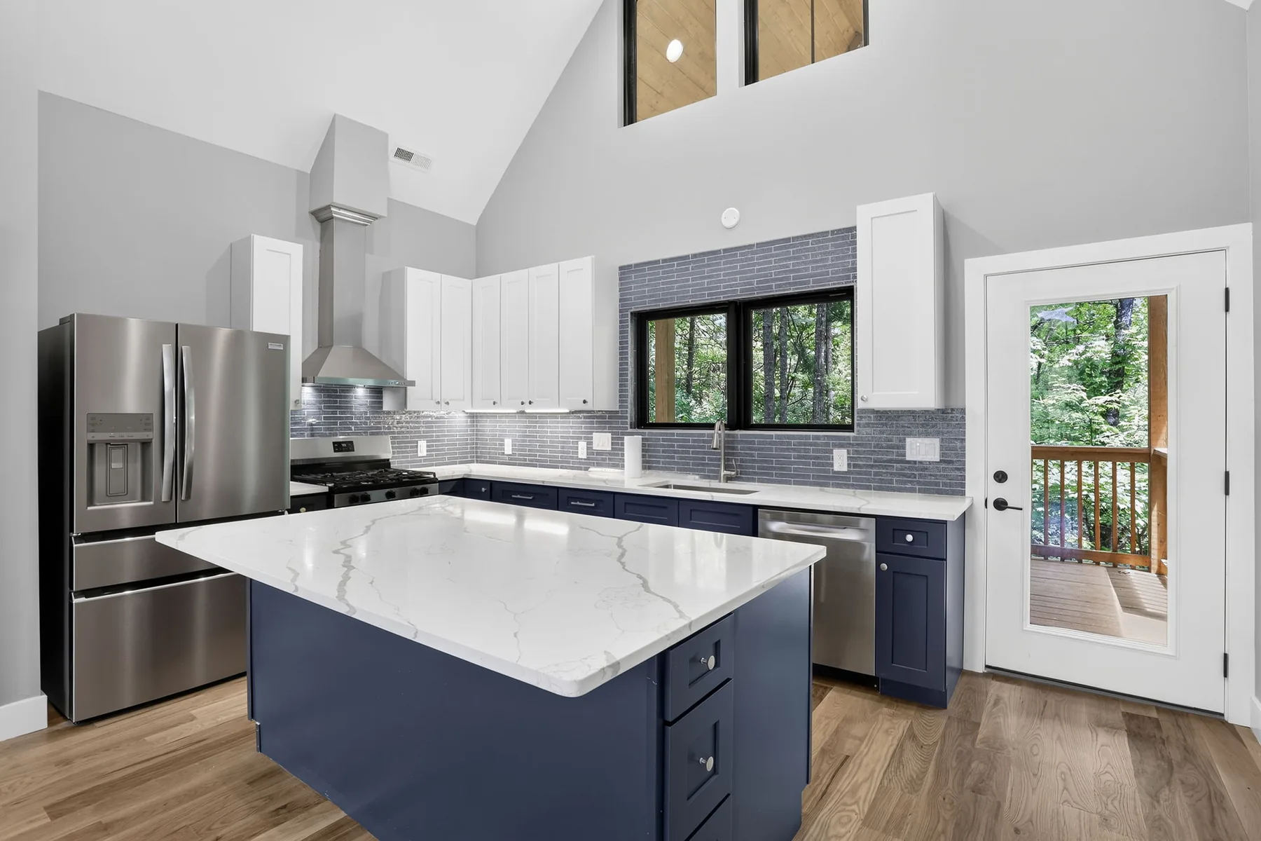 Custom kitchen with navy island, quartz counters and vaulted ceiling, Lake Lure NC