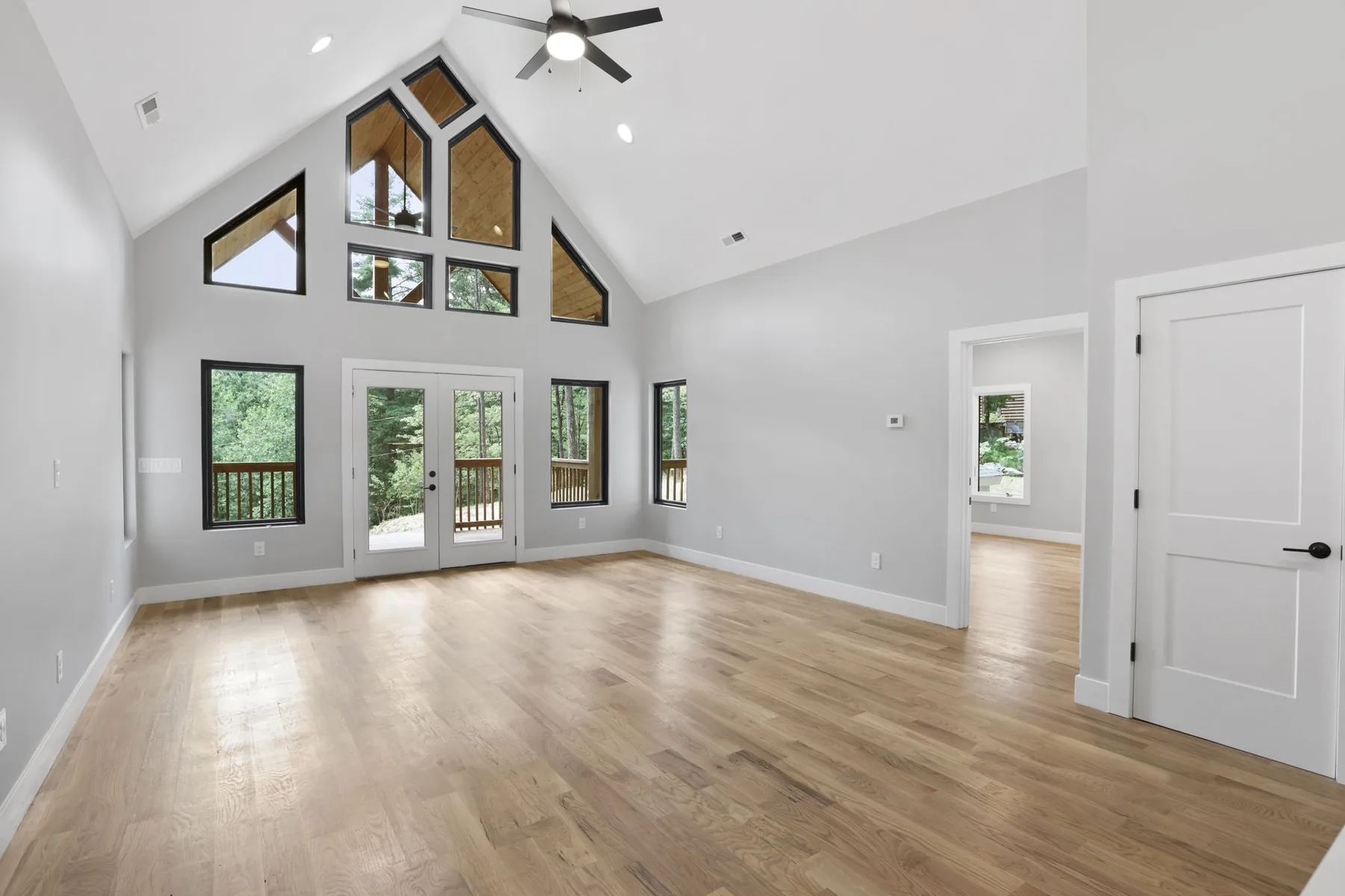 Open plan living area and kitchen under a vaulted ceiling, Lake Lure NC